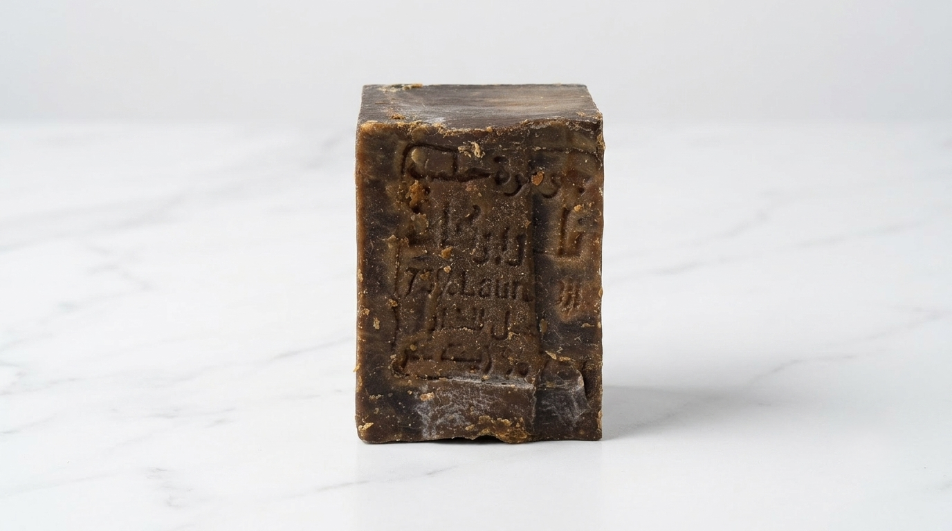 Avlia 75% Laurel Oil Aleppo Soap bar on clean white marble with clinical precise lighting, antifungal natural soap