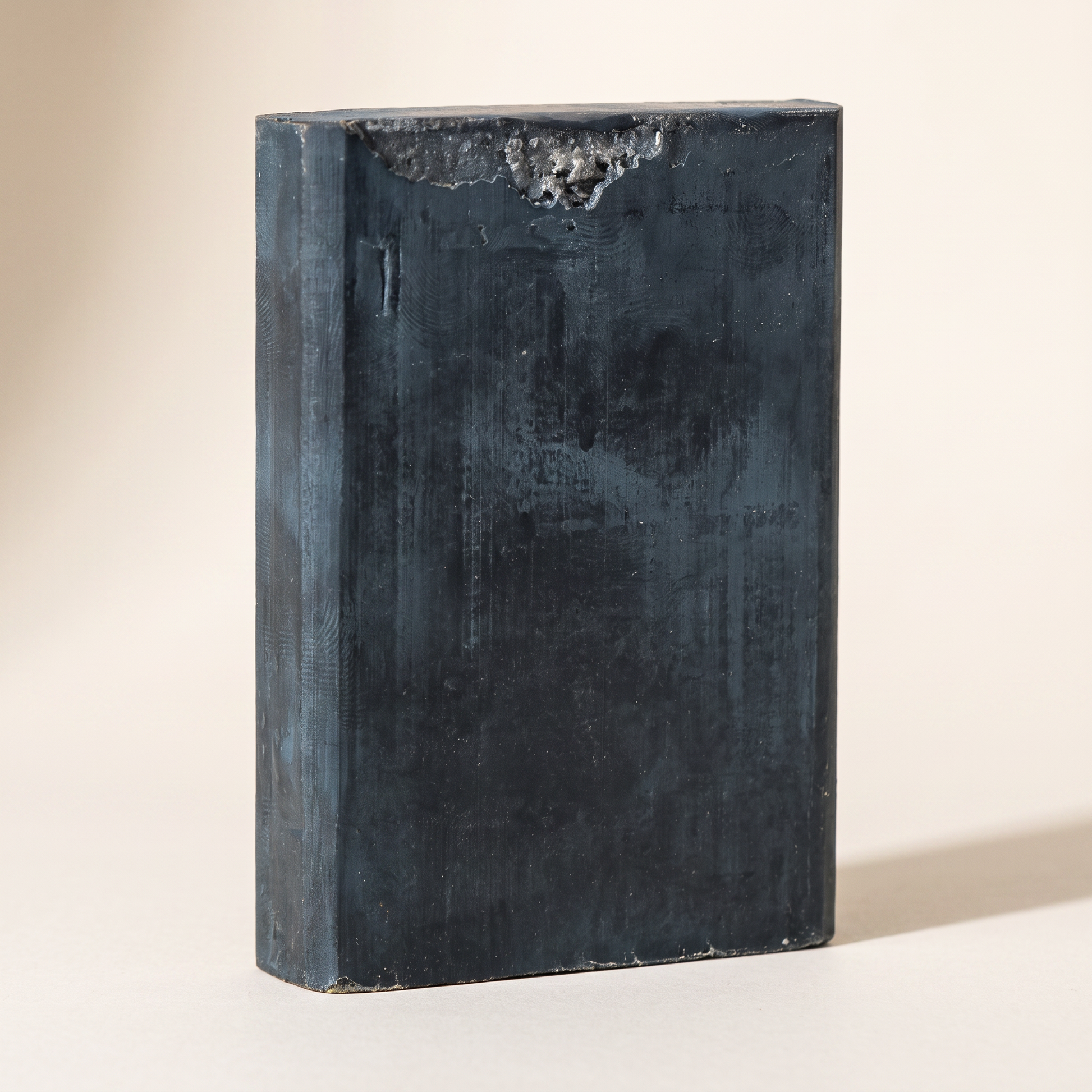 Avlia African Black Soap Bar standing on edge showing hand-cut thickness
