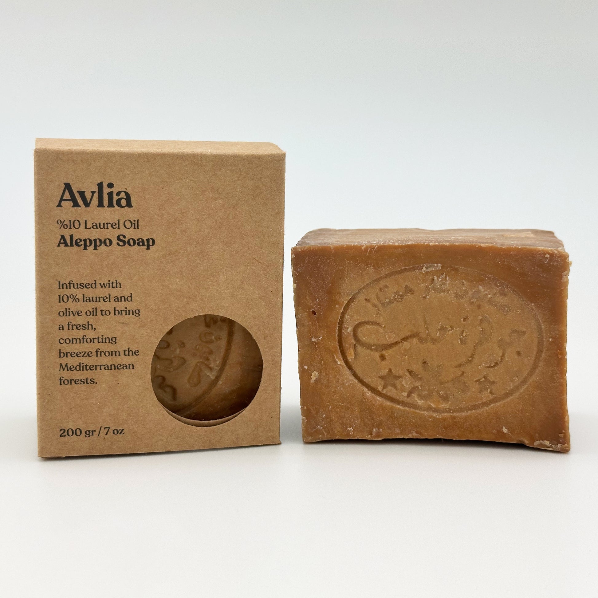 Avlia 10% Laurel Oil Aleppo Soap box placed beside the soap bar, showing product branding and soap details