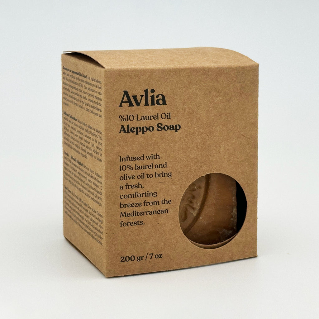 Avlia 10% Laurel Oil Aleppo Soap in eco-friendly kraft paper box packaging with circular cutout window, angled view