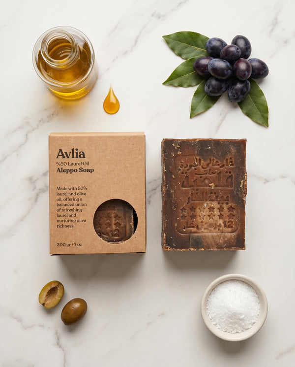 Avlia Aleppo soap range showing laurel oil percentage gradient arranged on natural stone surface