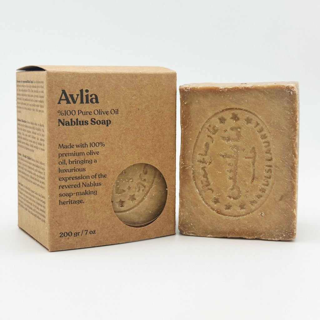 Avlia Nablus soap bar standing upright next to its brown paper packaging box