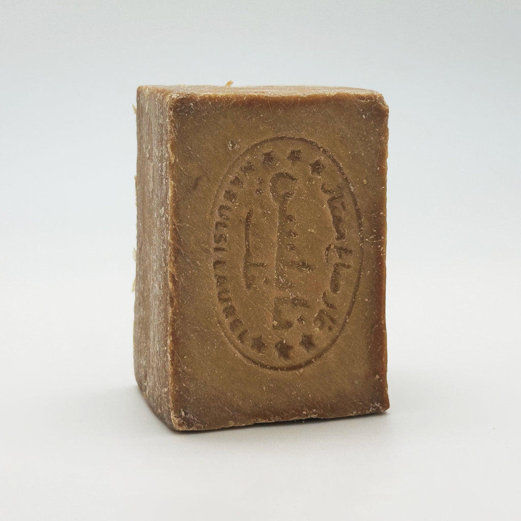 Avlia Nablus soap bar standing vertically, highlighting the Nabulsi Laurel stamp