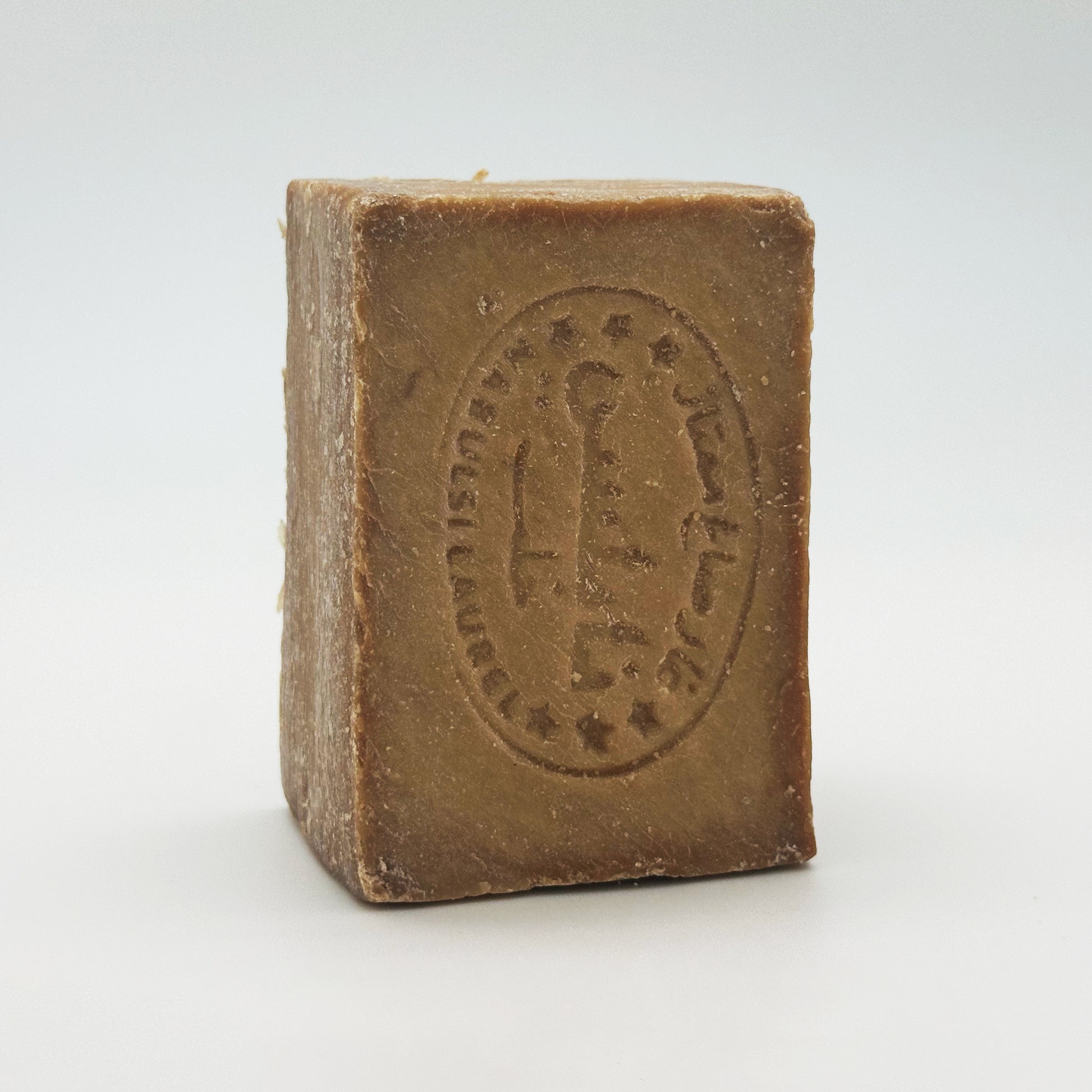 Avlia Nablus soap bar standing vertically, highlighting the Nabulsi Laurel stamp