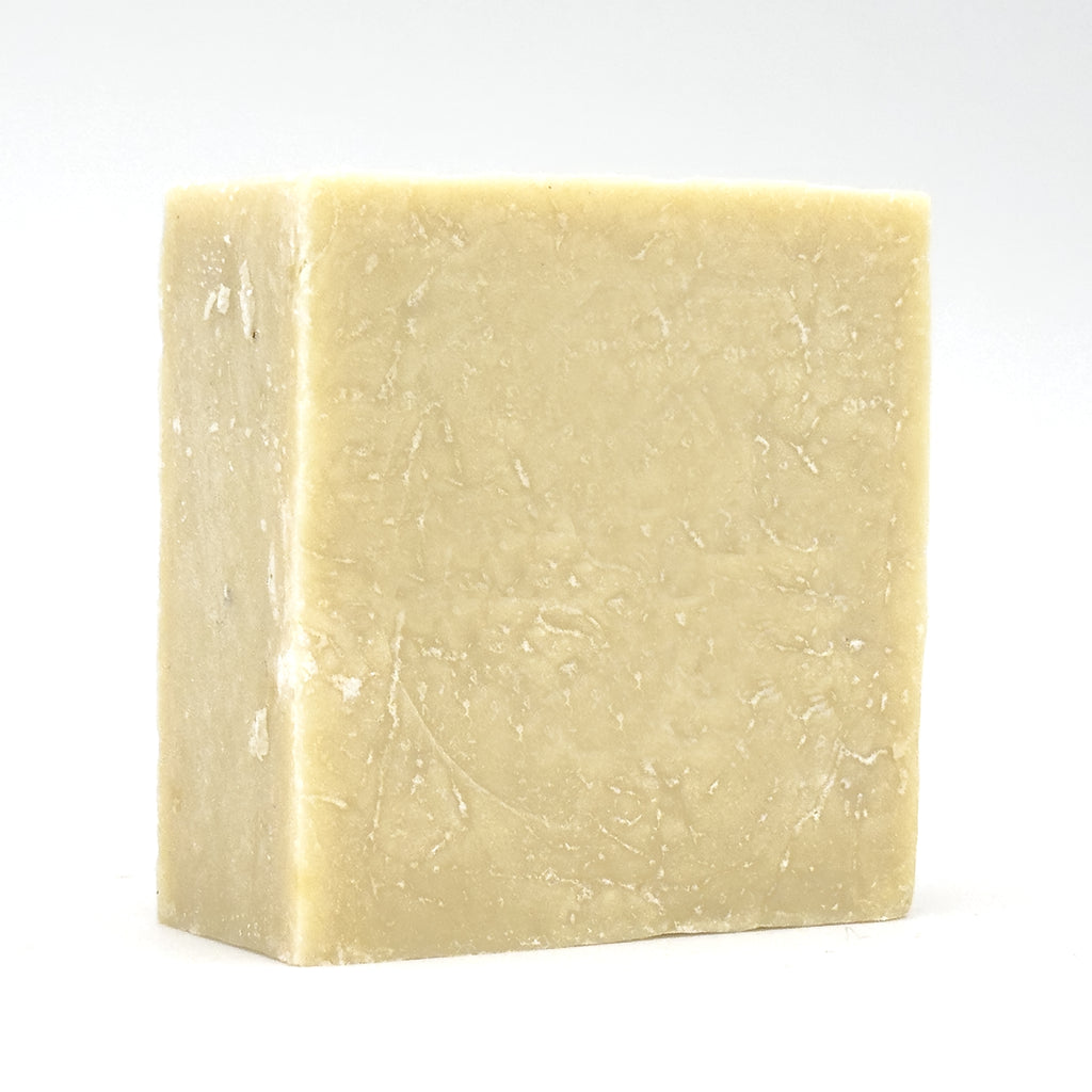 Avlia Turkish Hammam Soap – handmade olive oil soap with lemon and mint, angled studio view of the hand-cut ivory block on a white background