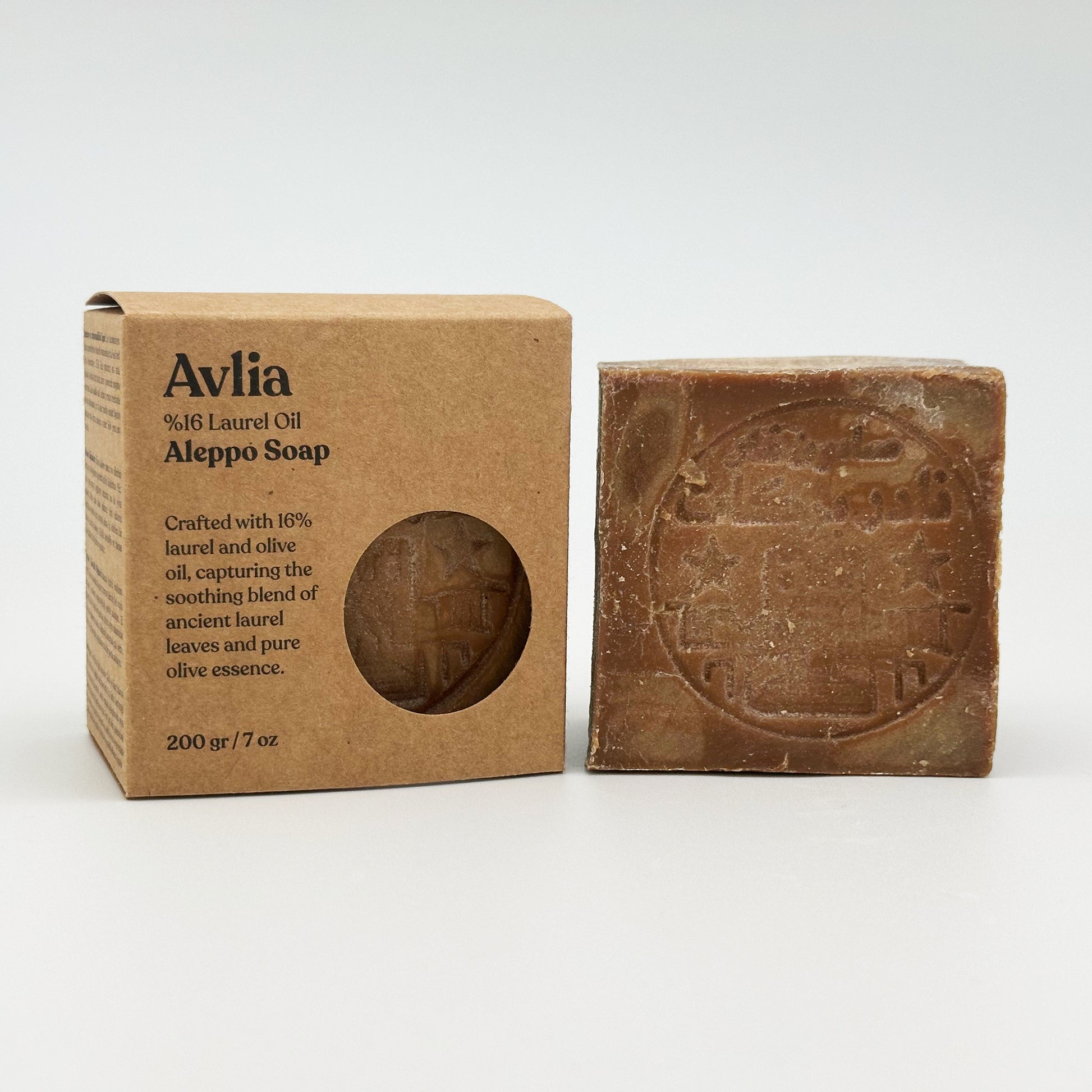 Avlia %16 laurel oil Aleppo soap cardboard box displayed next to an unwrapped soap bar with a traditional stamp