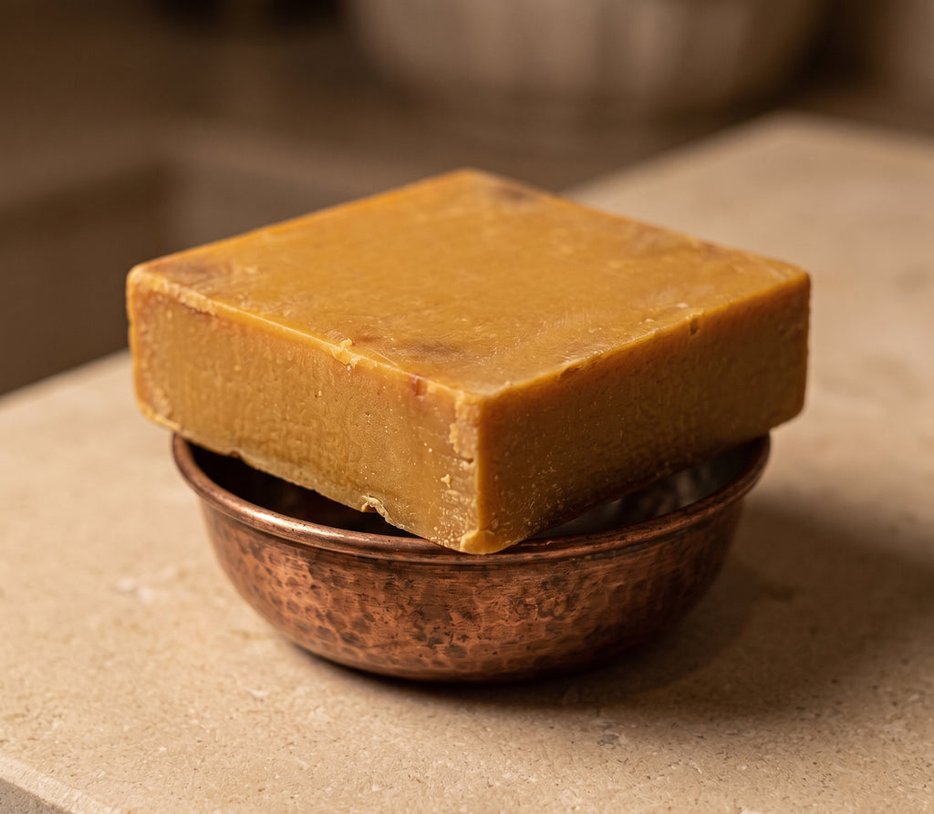 Avlia Pure Sulfur Soap with a copper hammam bowl, traditional bath styling.
