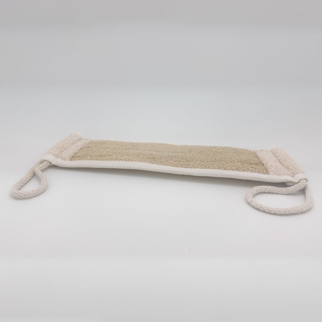 Avlia loofah bath strap laid flat showing full 39 cm length, open honeycomb loofah texture and cream cotton binding along every edge