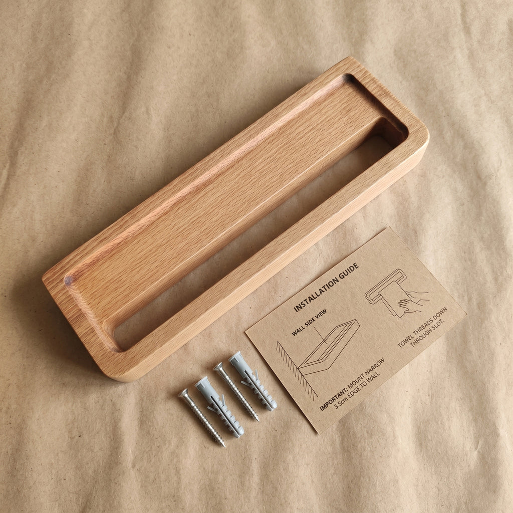 Avlia beechwood towel shelf unboxing flat lay with included mounting hardware — two screws and wall anchors on kraft paper, eco-friendly packaging