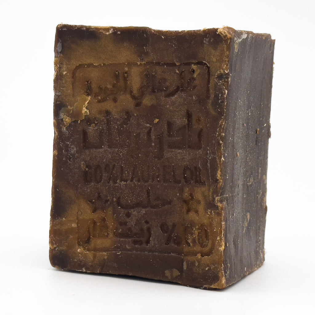 Avlia brand 60% laurel oil Aleppo soap bar standing upright, angled view showing side thickness