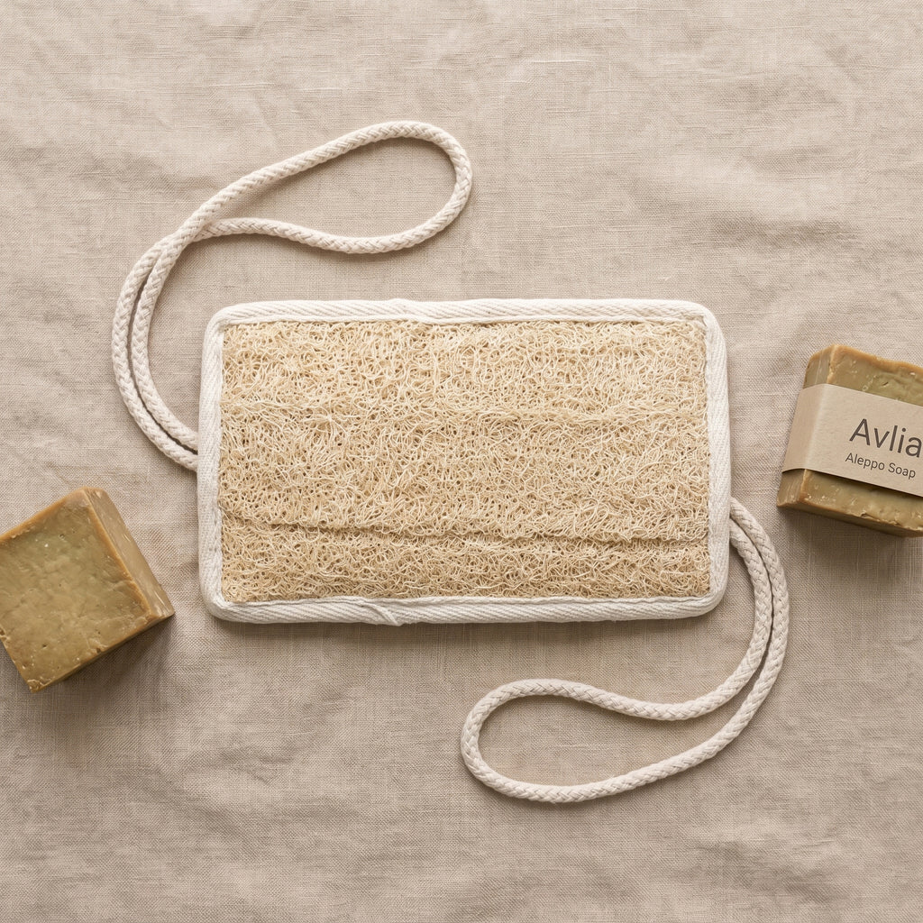 Avlia loofah back scrubber with Avlia Aleppo olive-laurel soap bars, complete eco bath collection range shot
