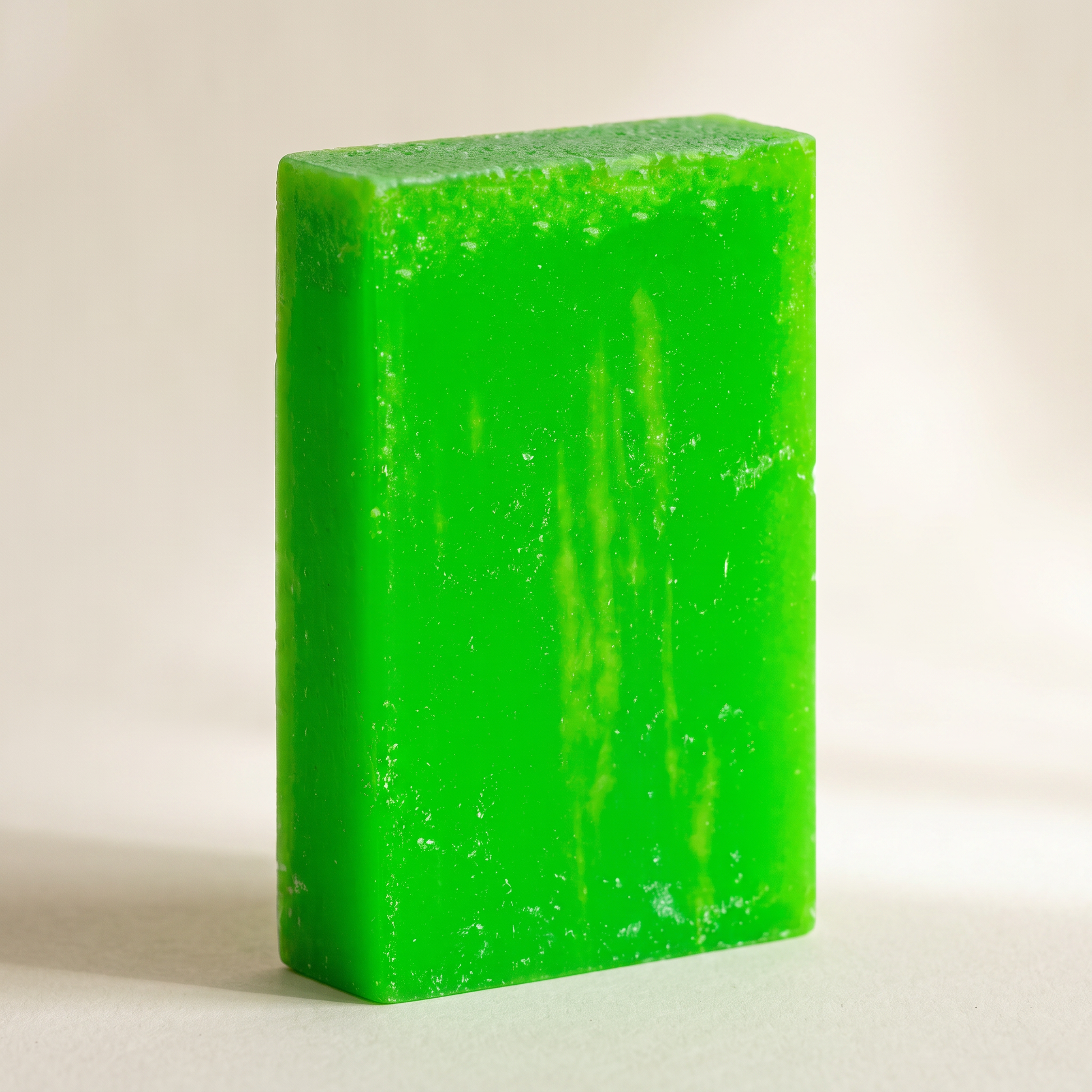 Avocado Oil Soap Bar standing on edge against a warm off-white backdrop, showing its hand-cut thickness