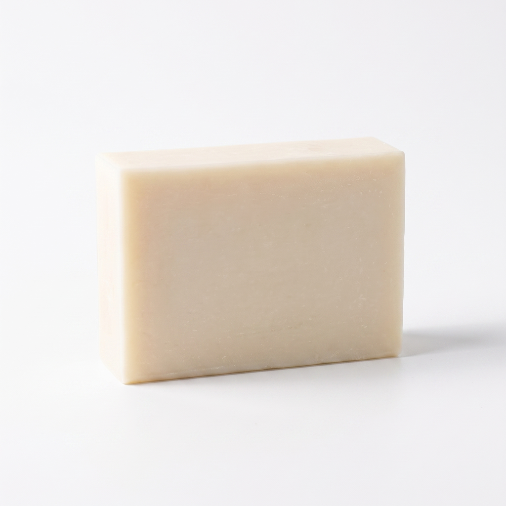 Goat Milk Soap bar on a plain white background, handmade cold-process soap, 100 g