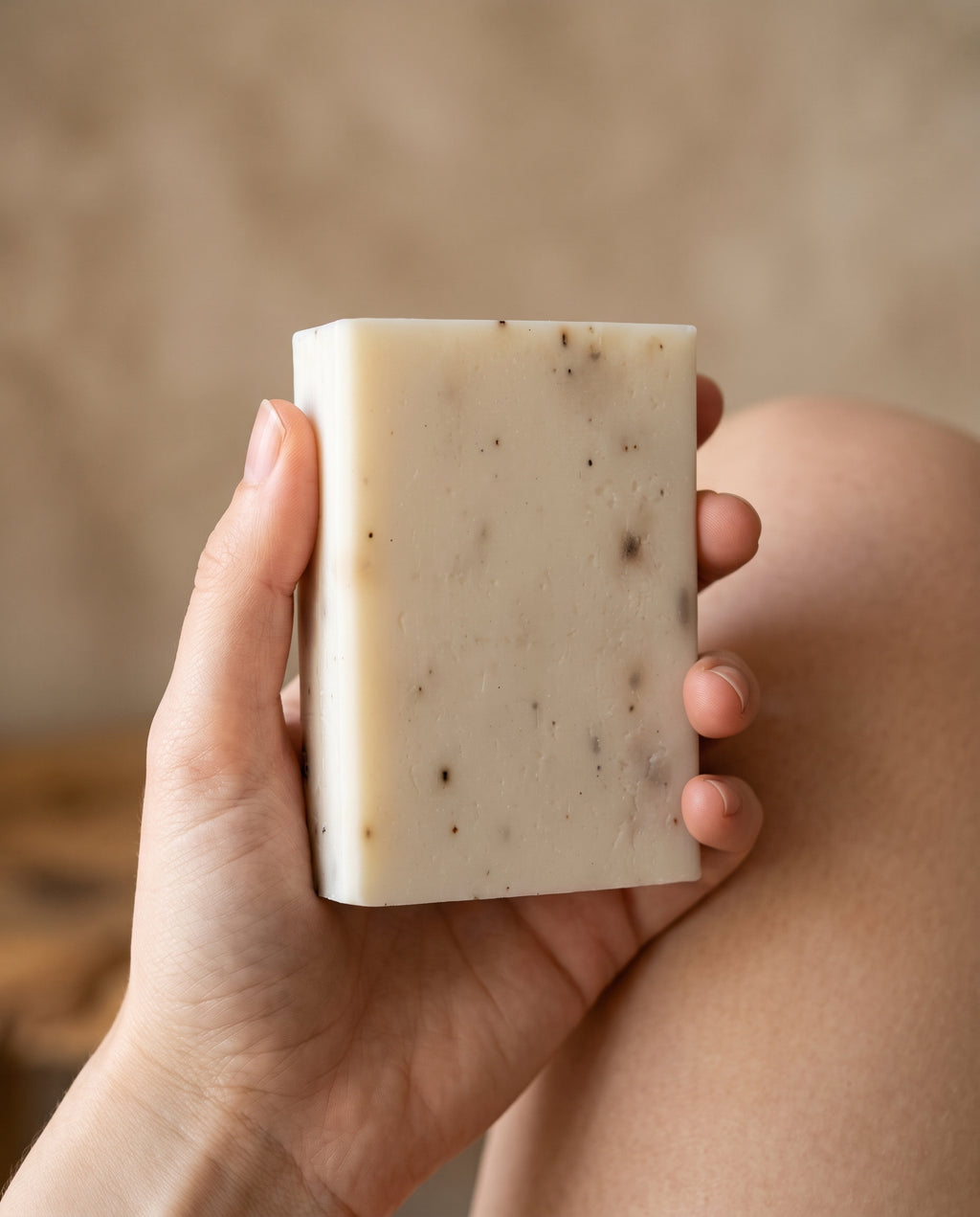 Hand holding Lavender Soap Bar against a soft neutral background, showing the size of the bar