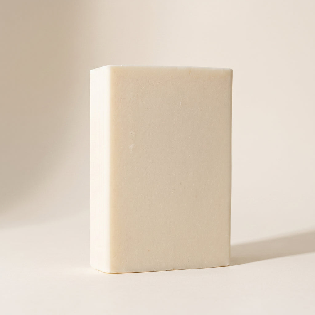 Jasmine Soap Bar standing on edge against a warm off-white backdrop, showing its hand-cut thickness