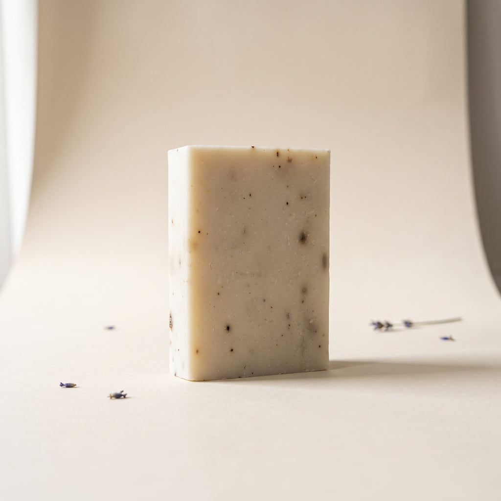 Lavender Soap Bar standing on edge against a warm off-white backdrop, showing its hand-cut thickness