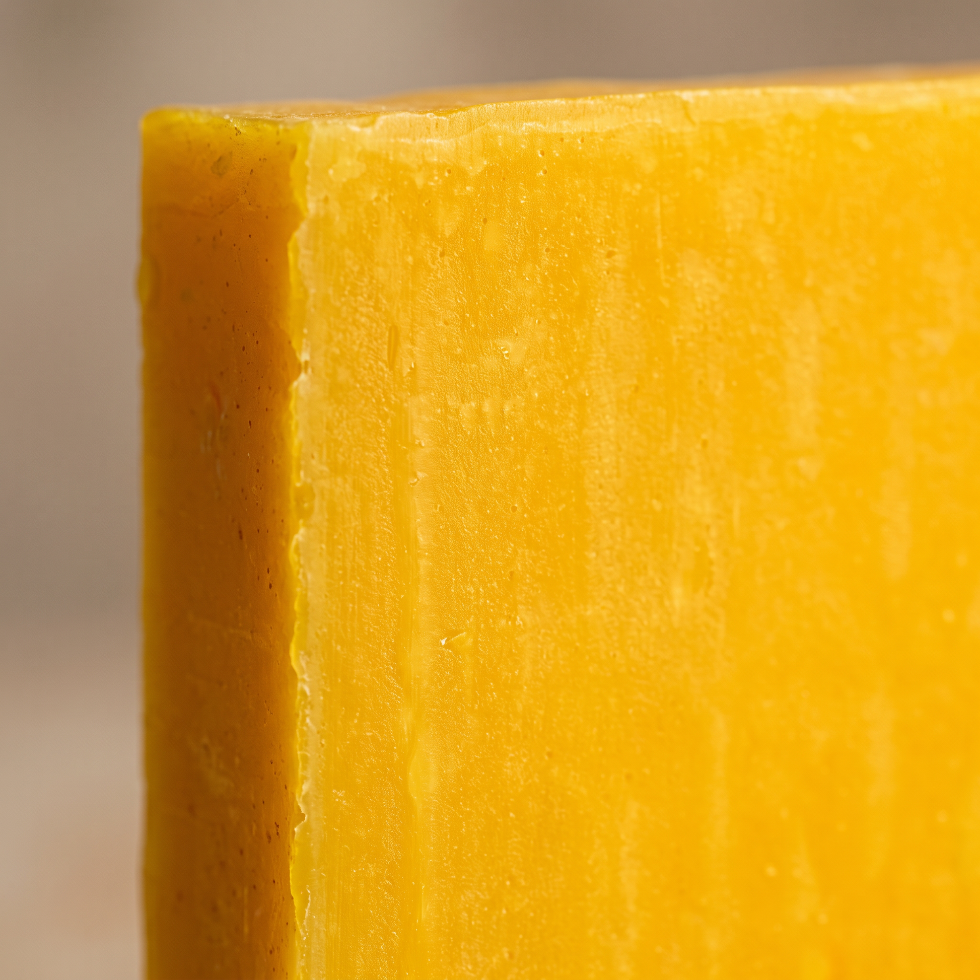 Macro close-up of hand-cut edge of Avlia Glycolic Acid & Orange Soap Bar