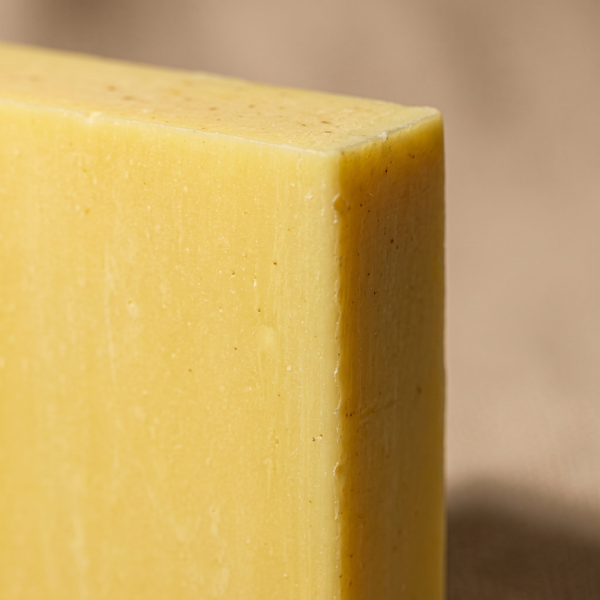 Macro close-up of the cut surface and hand-cut edge of Lemon Soap Bar