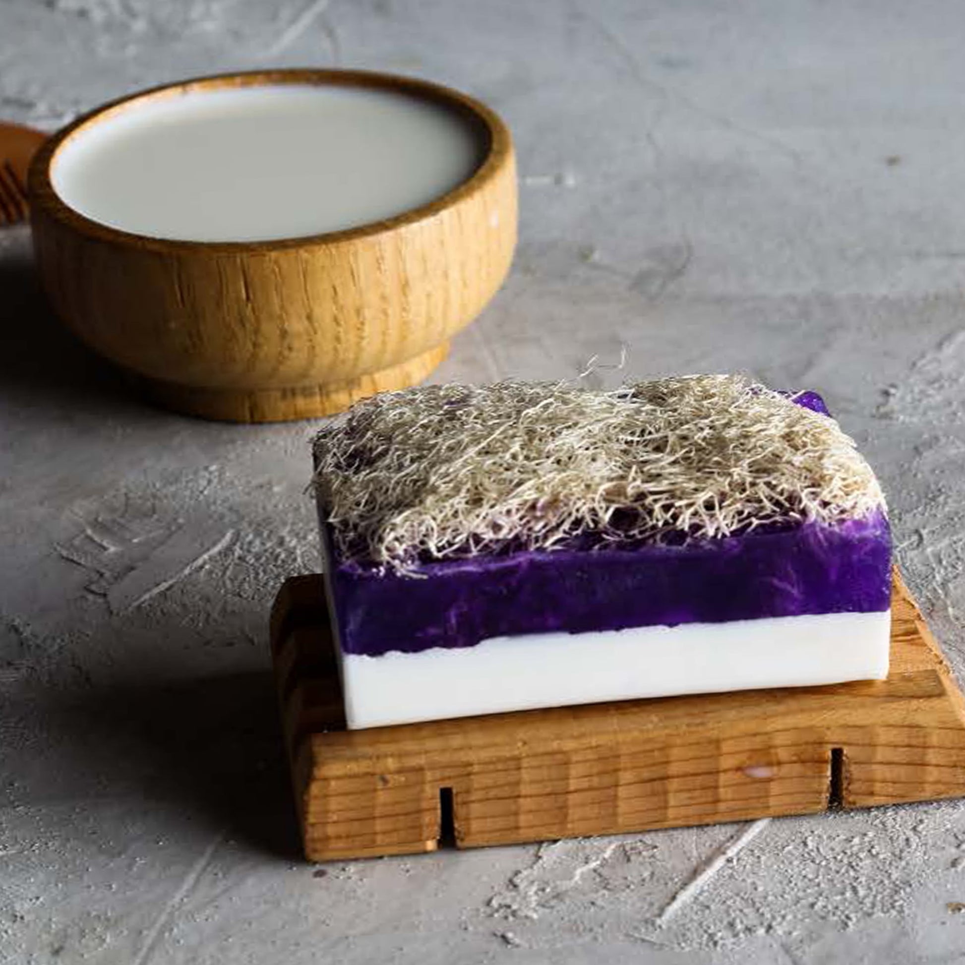 Natural exfoliating soap with built-in loofah sponge