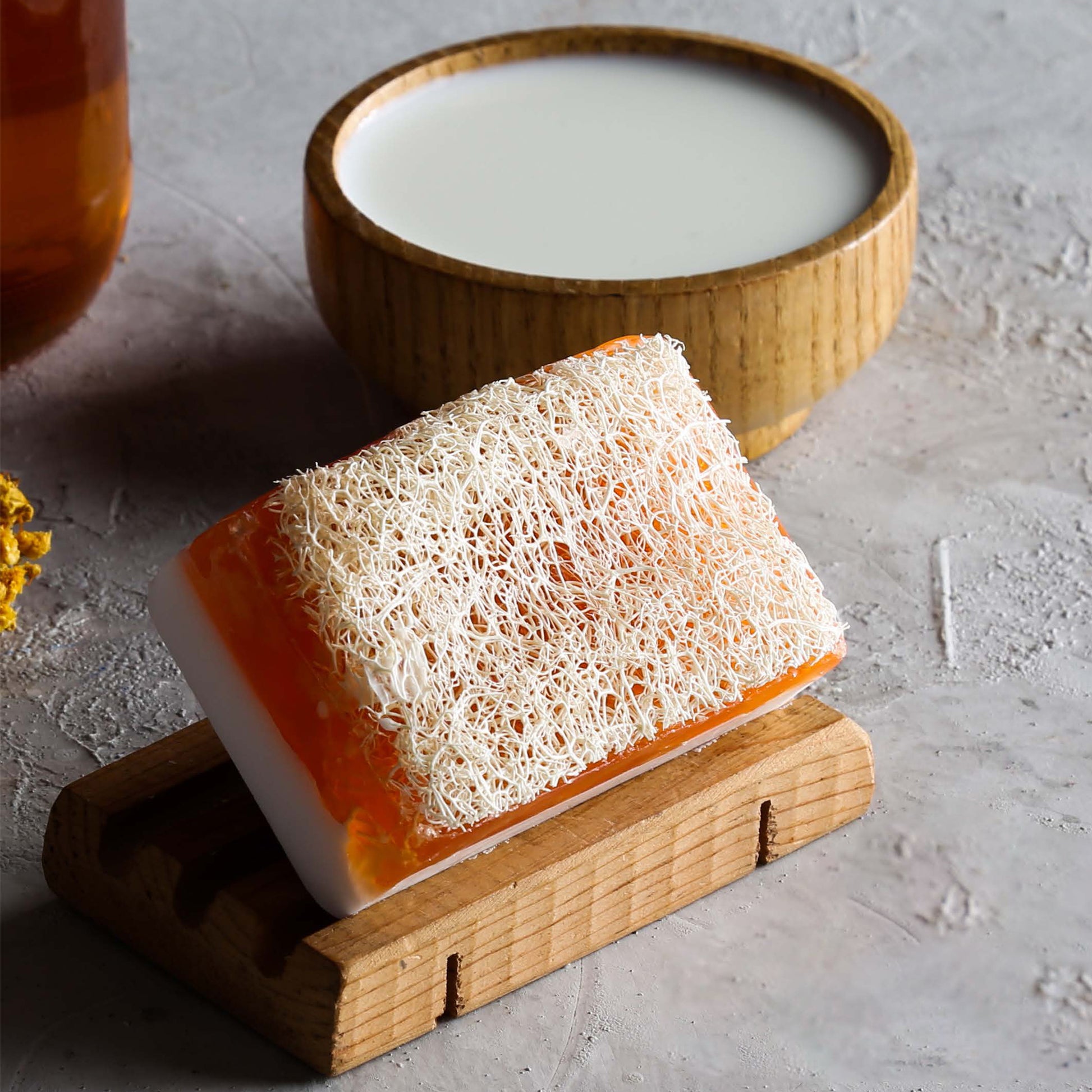 Oval loofah soap combining honey extract and sponge