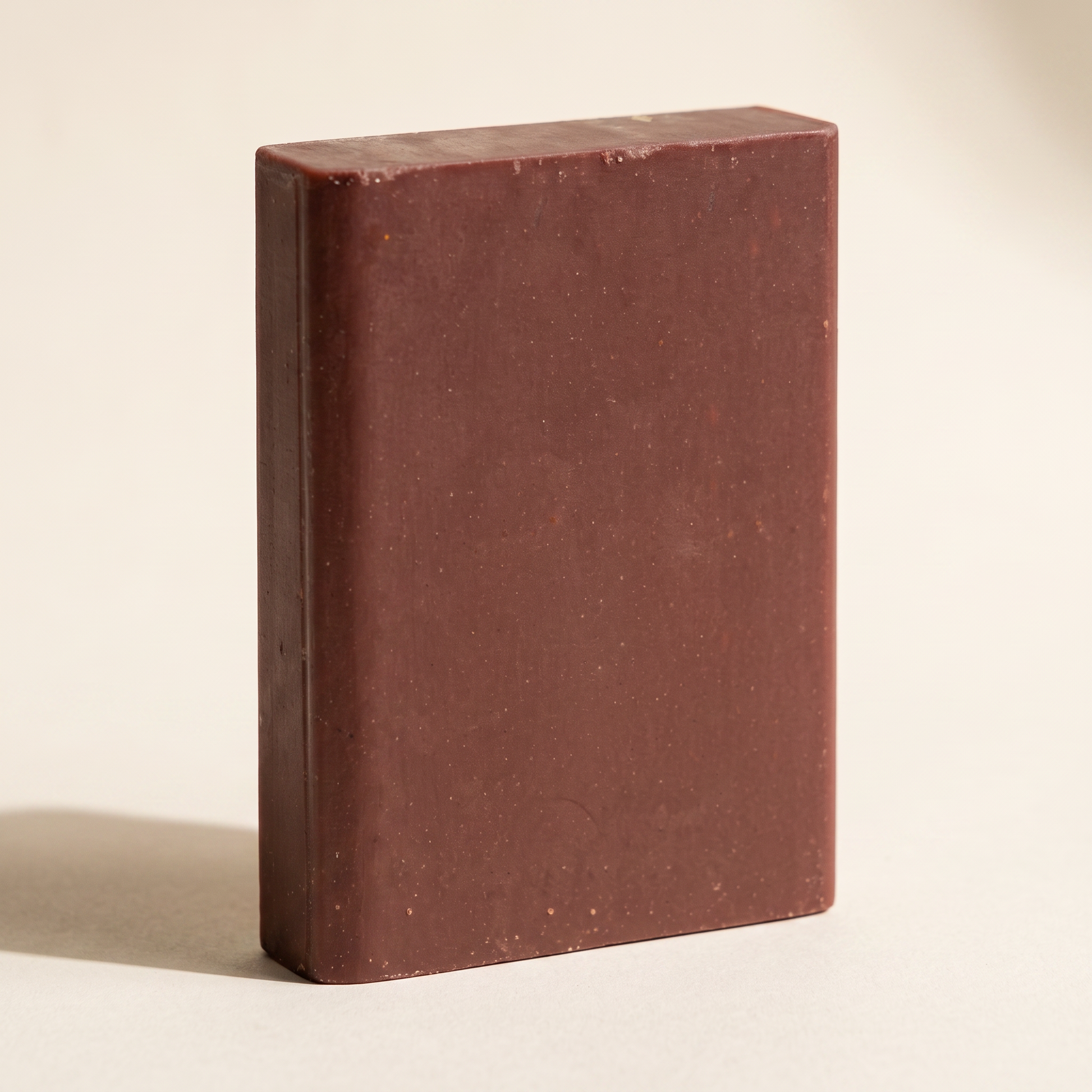 Pine Tar Soap Bar standing on edge against a warm off-white backdrop, showing its hand-cut thickness