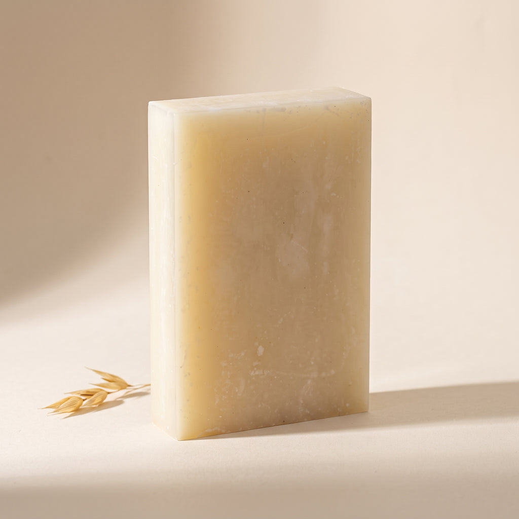 Rice Soap Bar standing on edge against a warm off-white backdrop, showing its hand-cut thickness