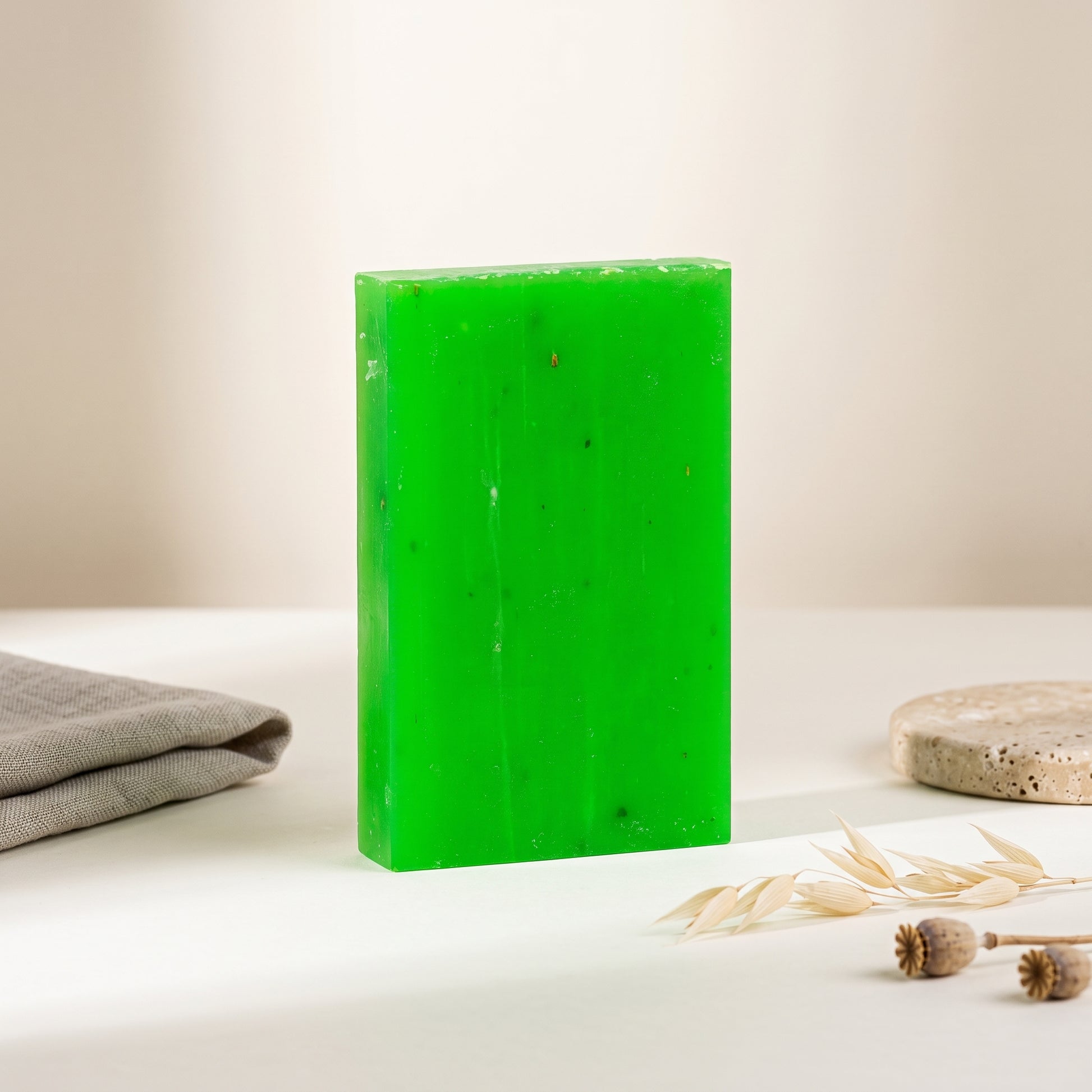 Rosemary Soap Bar standing on edge against a warm off-white backdrop, showing its hand-cut thickness