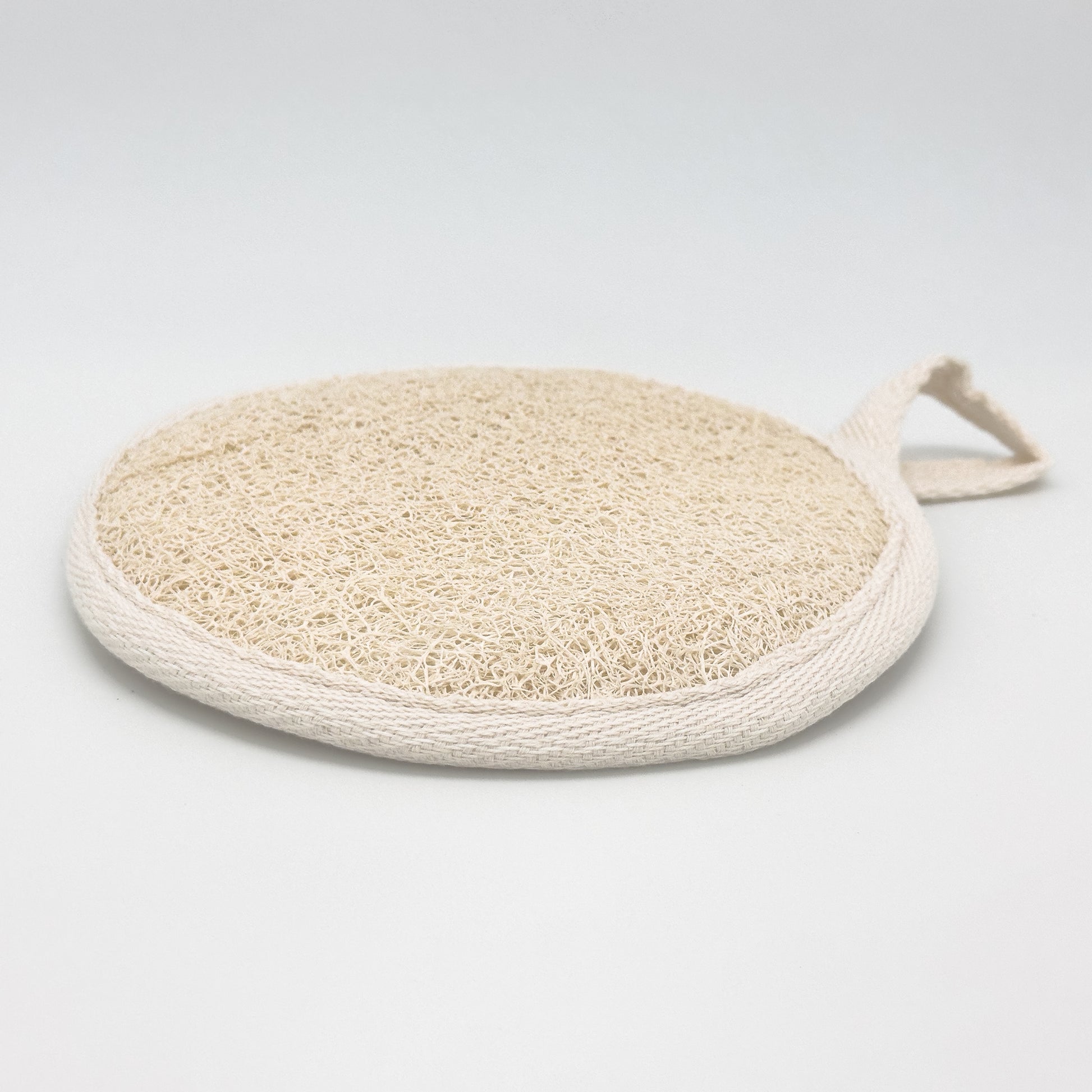 Round natural loofah exfoliating pad with cotton hanging loop on side, Luffa aegyptiaca body scrubber for eco bath