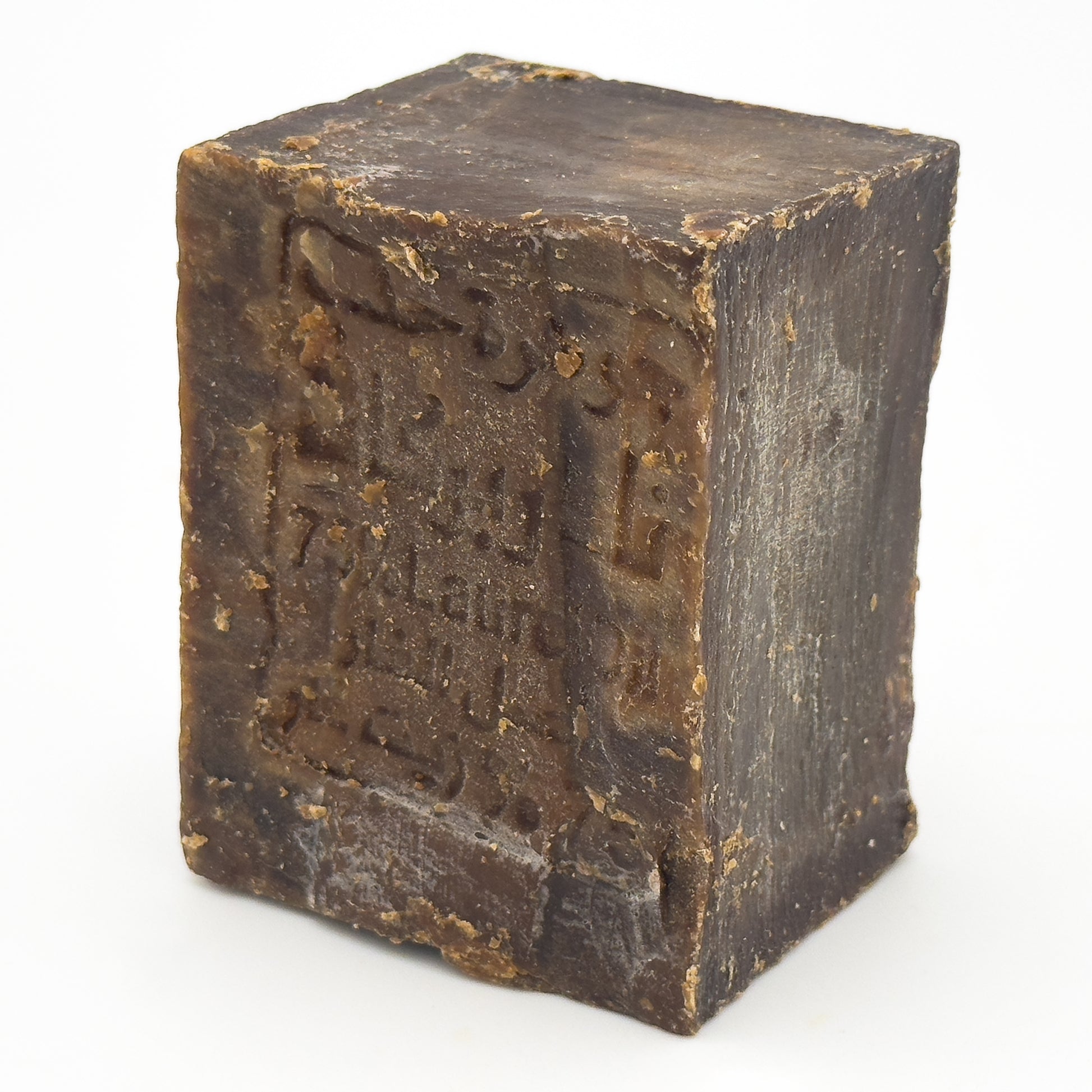 Side angle view of Avlia Aleppo Soap showing the block thickness and natural aging texture