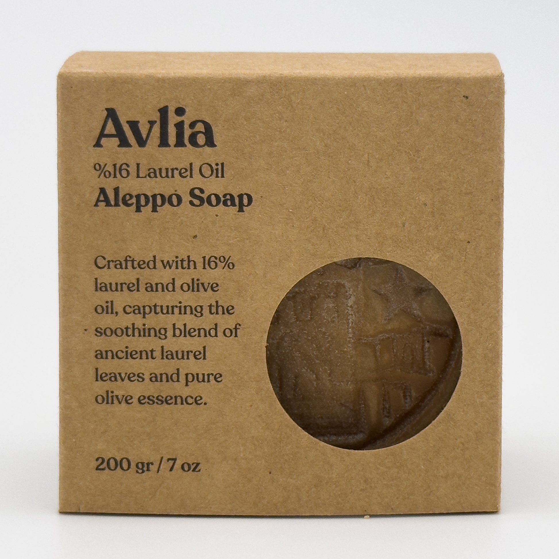 Straight-on front view of the Avlia %16 laurel oil Aleppo soap box with a circular cutout revealing the soap inside