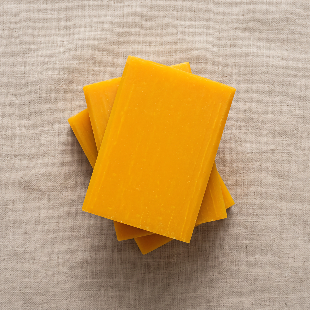 Three Avlia Glycolic Acid & Orange Soap Bars stacked showing hand-cut edges