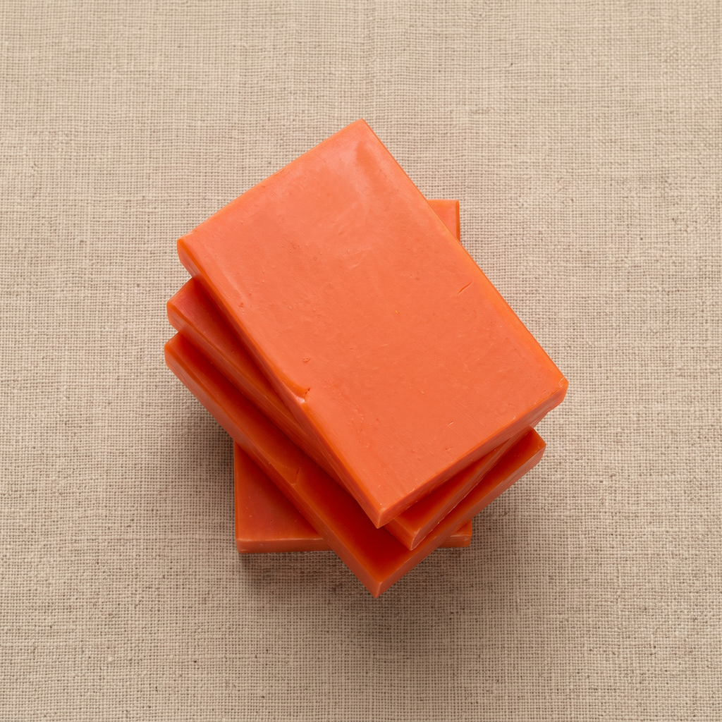 Three Avlia Kojic Acid & Turmeric Soap Bars stacked showing hand-cut edges