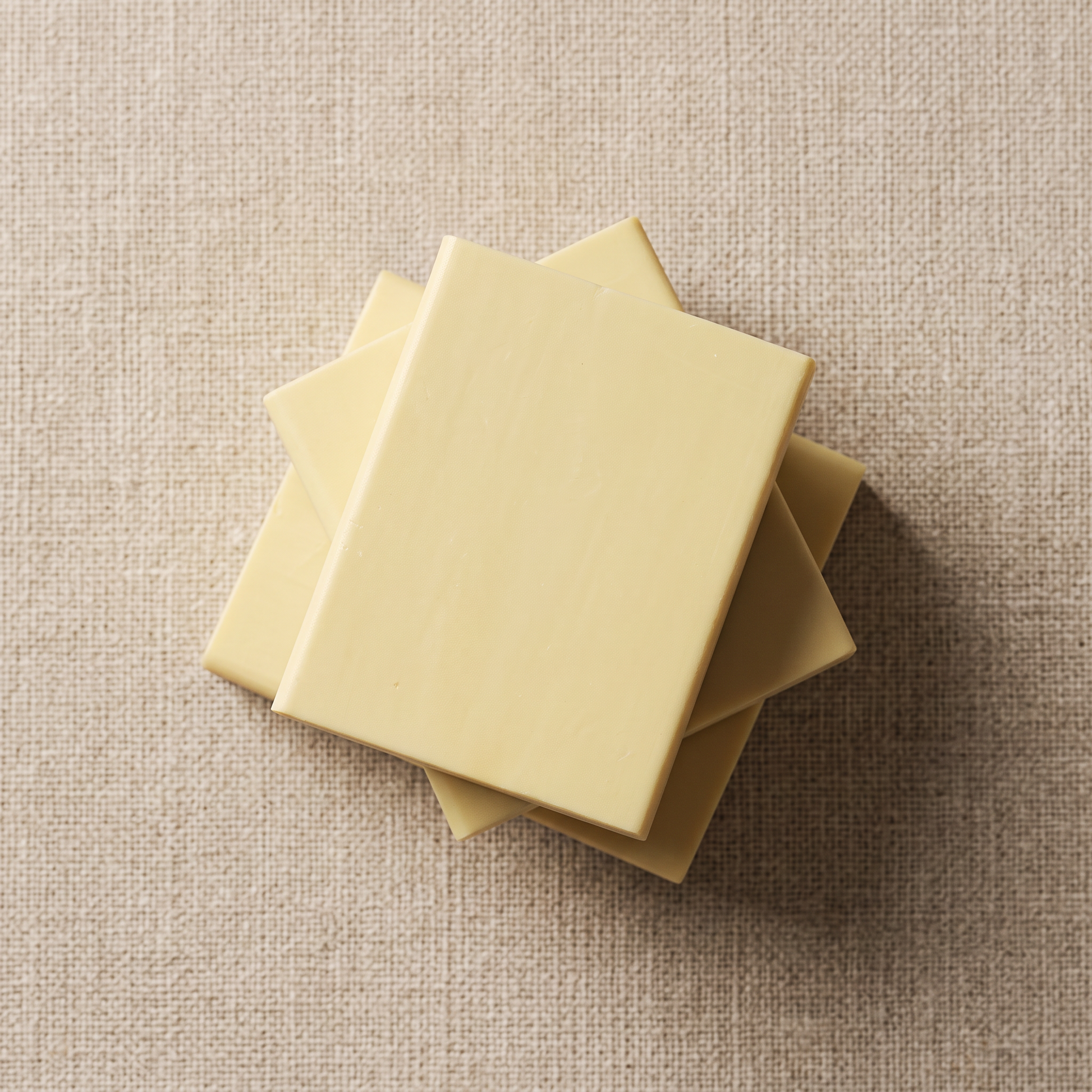 Three Sulfur Soap Bars stacked on natural linen, showing the hand-cut edges