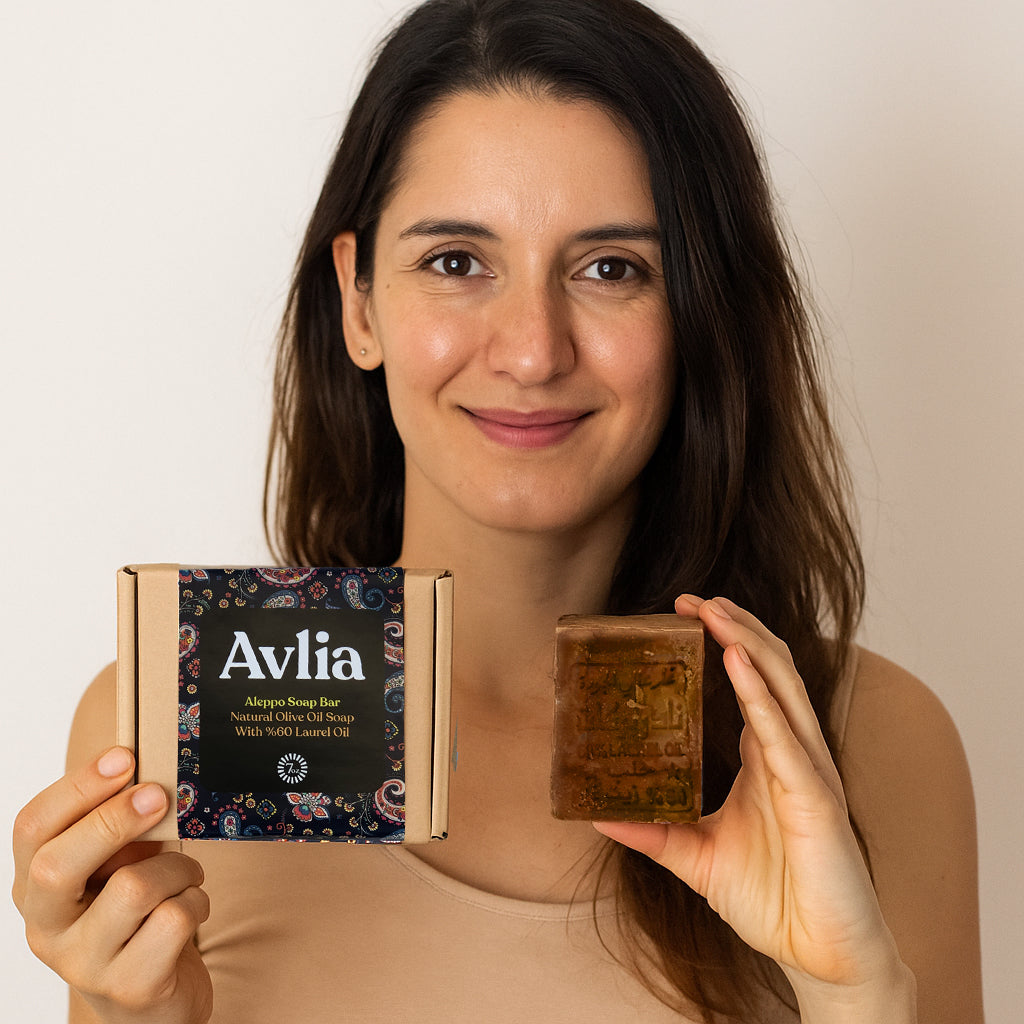 Woman Holding %60 Laurel Oil Aleppo Soap Bar and Avlia brand Box