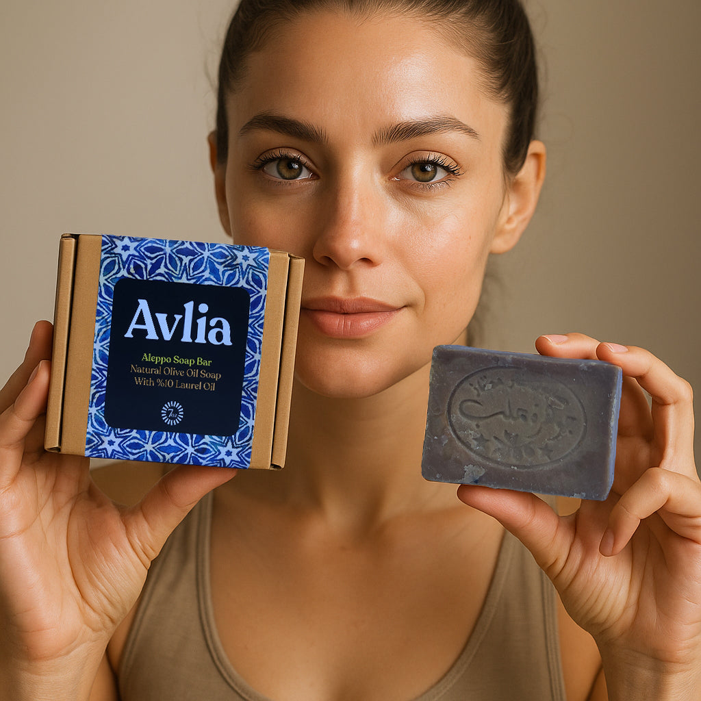 Woman holding Avlia Aleppo soap 10% laurel oil bar